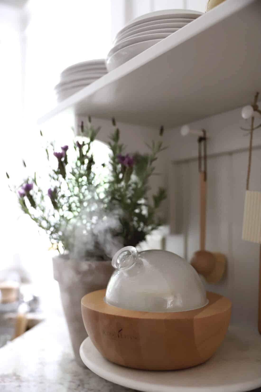 a young living aria diffuser on a kitchen counter