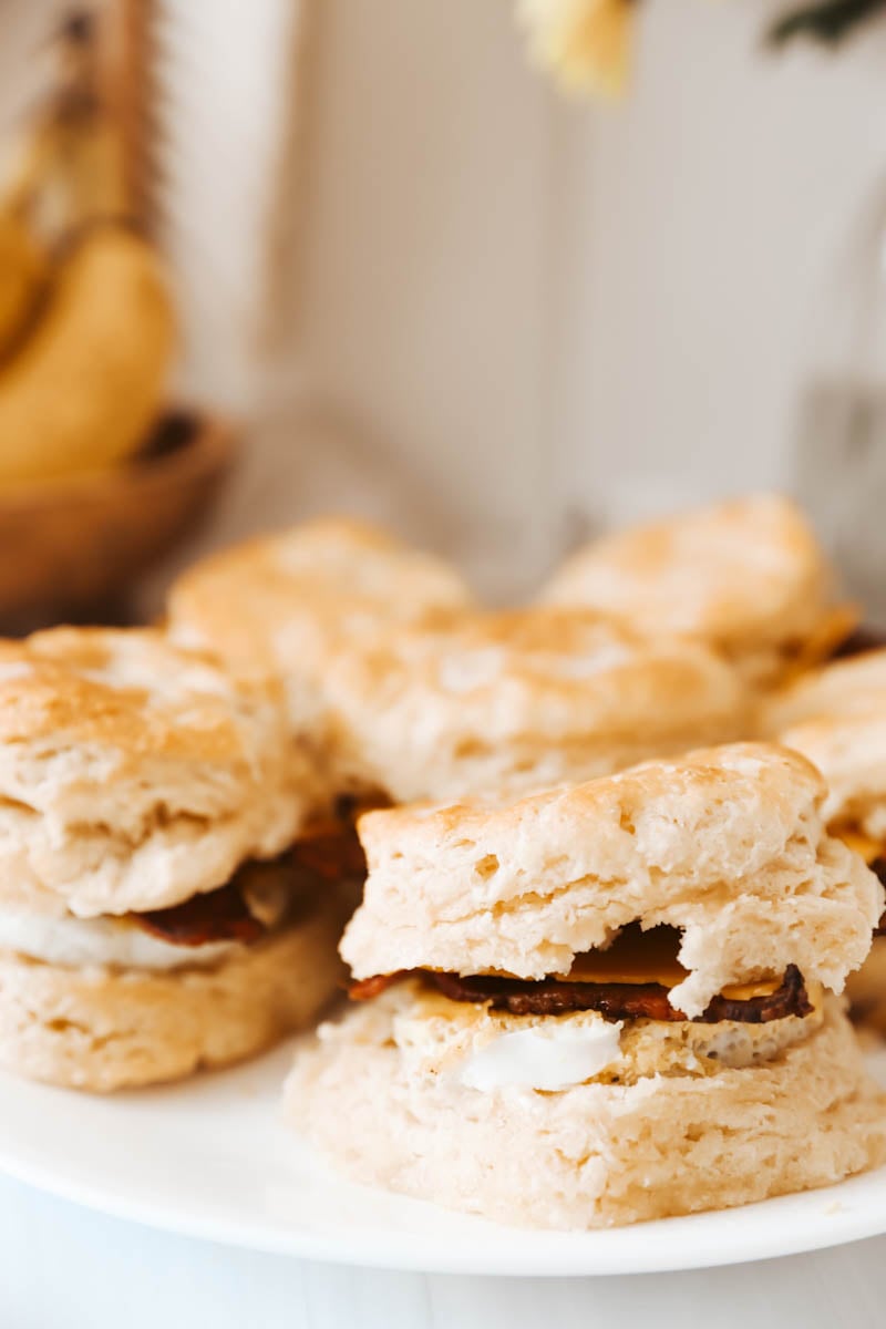 flaky biscuit with bacon and egg on it
